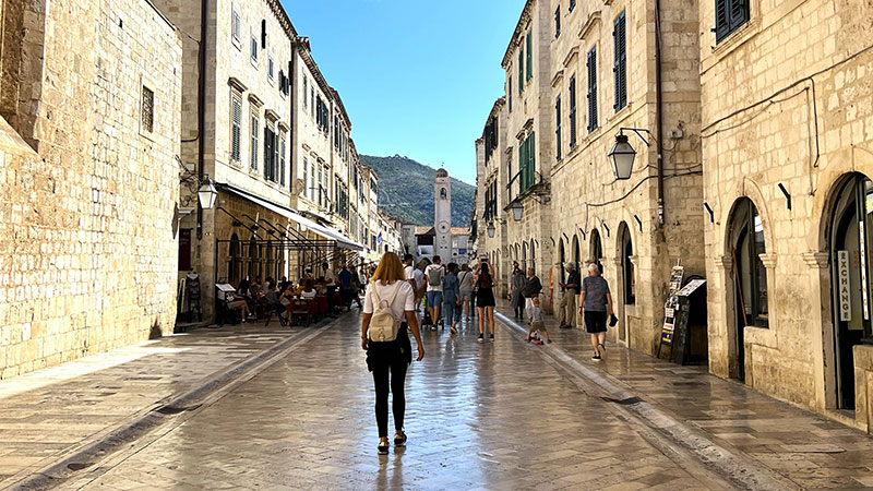 Woman walking in street of Old Town Dubrovnik